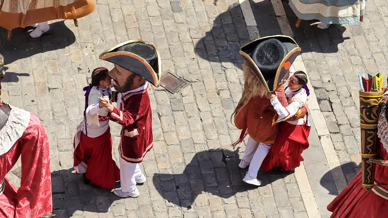 Two giants dance face to face in the Old Town (2018).